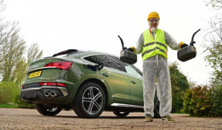Audi SQ5 long-termer - Sean Carson holding two Jerry cans