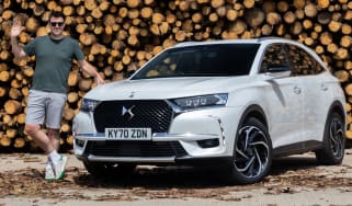 DS 7 E-Tense - Steve Walker with DS 7 in front of a log pile