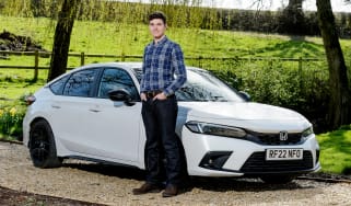 Tristan Shale-Hester standing next to the Honda Civic Sport