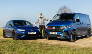 Dean Gibson standing between Volkswagen Golf and Volkswagen Transporter